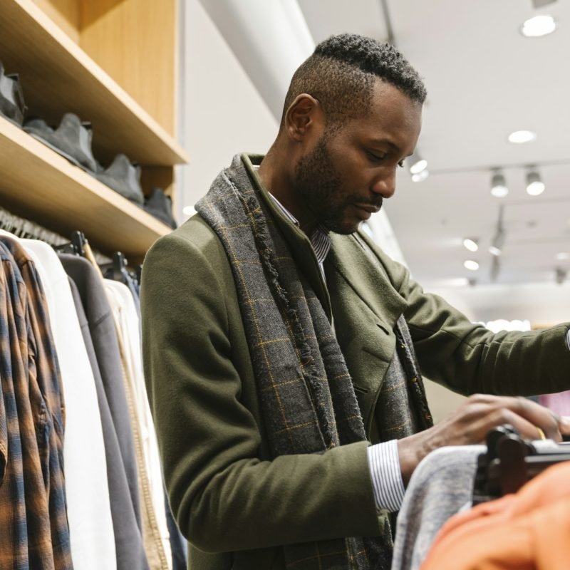 Stylish man shopping in a clothes store